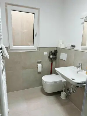 Ein Badezimmer in der Unterkunft EMMA Gardencity Basement Flat
