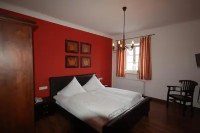 Ein Bett oder Betten in einem Zimmer der Unterkunft Hotel Lutz