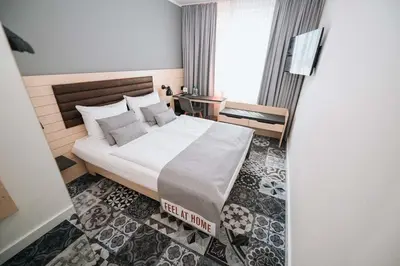 Ein Bett oder Betten in einem Zimmer der Unterkunft Coffee Fellows Hotel München-Freiham