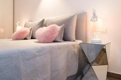 Ein Bett oder Betten in einem Zimmer der Unterkunft Palace am See