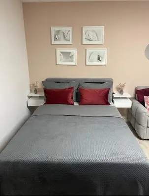 Ein Bett oder Betten in einem Zimmer der Unterkunft Apartment AS mit Balkon