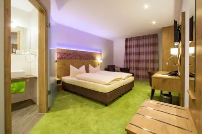 Ein Bett oder Betten in einem Zimmer der Unterkunft Hotel Bauer garni