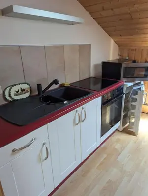 Küche/Küchenzeile in der Unterkunft Eigene Etage im charmanten Holzhaus