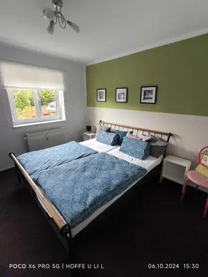 Ein Bett oder Betten in einem Zimmer der Unterkunft Ferienwohnung Rösenau