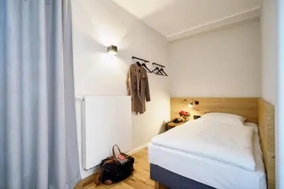Ein Bett oder Betten in einem Zimmer der Unterkunft Gasthof Neuwirt Unterföhring