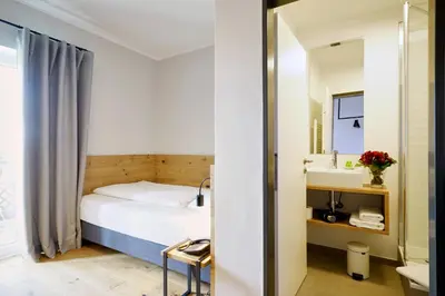 Ein Bett oder Betten in einem Zimmer der Unterkunft Gasthof Neuwirt Unterföhring