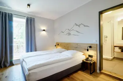 Ein Bett oder Betten in einem Zimmer der Unterkunft Gasthof Neuwirt Unterföhring