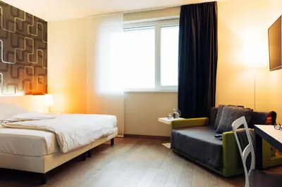 Ein Bett oder Betten in einem Zimmer der Unterkunft harry's home München hotel & apartments