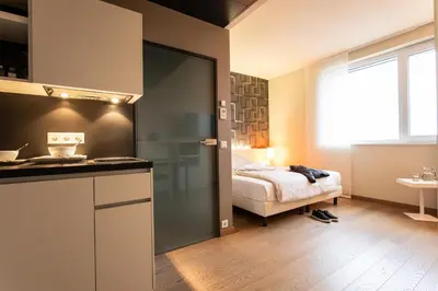 Ein Bett oder Betten in einem Zimmer der Unterkunft harry's home München hotel & apartments