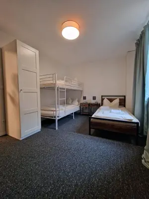 Ein Bett oder Betten in einem Zimmer der Unterkunft LivBiz Apartments - Adelsried