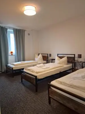 Ein Bett oder Betten in einem Zimmer der Unterkunft LivBiz Apartments - Adelsried