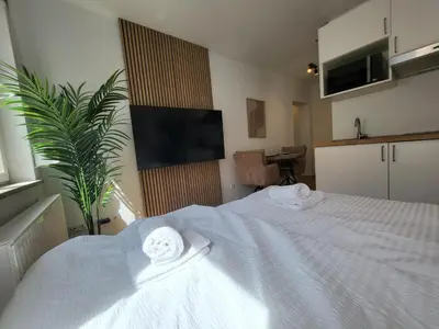 Ein Bett oder Betten in einem Zimmer der Unterkunft SiOUX stilvolle Designapartments im Zentrum