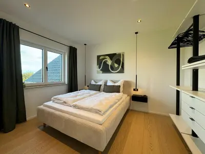 Ein Bett oder Betten in einem Zimmer der Unterkunft Neues Repräsentatives Designer Loft im Herzen Bayerns