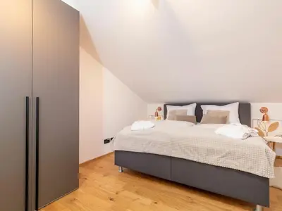 Ein Bett oder Betten in einem Zimmer der Unterkunft Chiemgauloft Comfortable holiday residence
