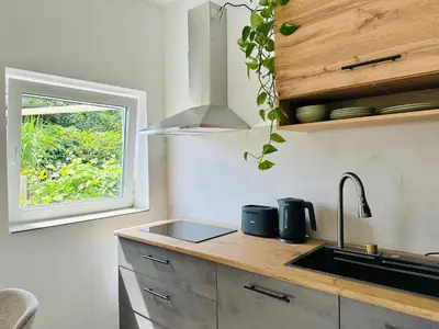 Küche/Küchenzeile in der Unterkunft Modern und stilvoll eingerichtetes Tiny House