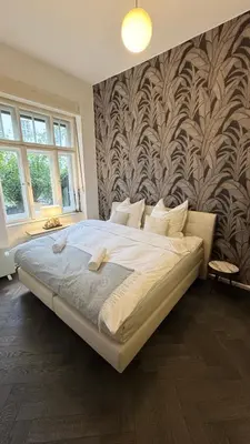 Ein Bett oder Betten in einem Zimmer der Unterkunft Exklusive Wohnung im Herzen Münchens