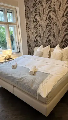 Ein Bett oder Betten in einem Zimmer der Unterkunft Exklusive Wohnung im Herzen Münchens