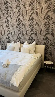Ein Bett oder Betten in einem Zimmer der Unterkunft Exklusive Wohnung im Herzen Münchens