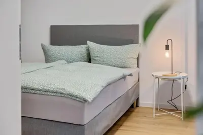 Ein Bett oder Betten in einem Zimmer der Unterkunft Cityperle - im Herzen Augsburgs