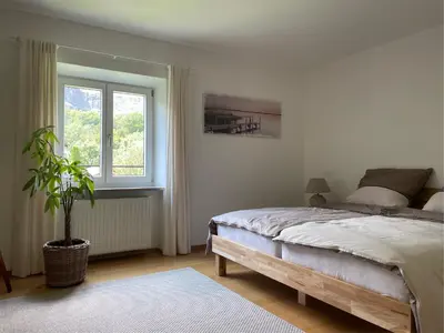 Ein Bett oder Betten in einem Zimmer der Unterkunft Haus KaiserInn - komfortable Wohnung 82 qm TOP ausgestattet, 2 Schlafzimmer mit Balkon und Bergblick