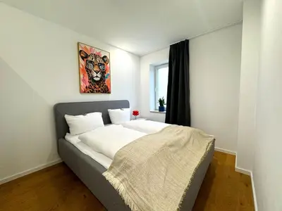 Ein Bett oder Betten in einem Zimmer der Unterkunft ma suite - urban apartment city center - private parking 2-4P