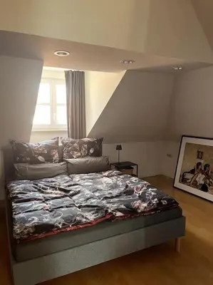 Ein Bett oder Betten in einem Zimmer der Unterkunft Über den Dächern der Landshuter Altstadt