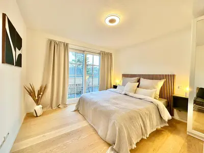 Ein Bett oder Betten in einem Zimmer der Unterkunft MAVIE Living in Breitbrunn am Ammersee