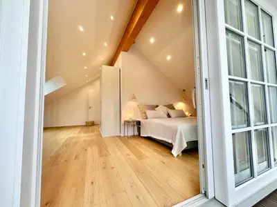 Ein Bett oder Betten in einem Zimmer der Unterkunft MAVIE Living in Breitbrunn am Ammersee