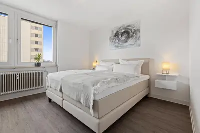 Ein Bett oder Betten in einem Zimmer der Unterkunft Primero Relax-Home I Premium Apartments ab 90qm I Balkon Garage I A8-Fuggerei