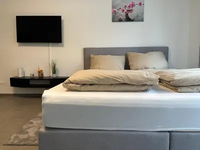 Ein Bett oder Betten in einem Zimmer der Unterkunft modernes Apartment in guter Lage