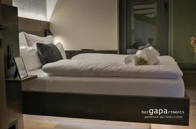 Ein Bett oder Betten in einem Zimmer der Unterkunft BergRetreat mit Sauna & Garten