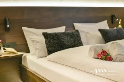 Ein Bett oder Betten in einem Zimmer der Unterkunft BergAlpine