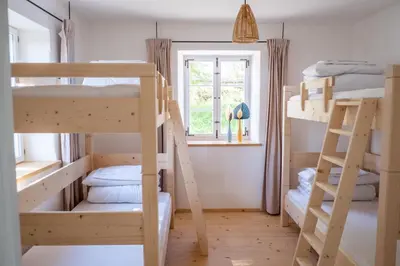 Ein Bett oder Betten in einem Zimmer der Unterkunft Pilgerhaus Wildsteig