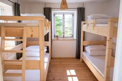Ein Bett oder Betten in einem Zimmer der Unterkunft Pilgerhaus Wildsteig