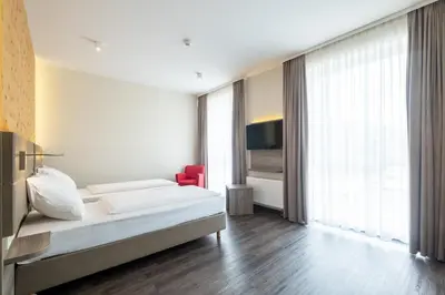 Ein Bett oder Betten in einem Zimmer der Unterkunft Amaro Hotel