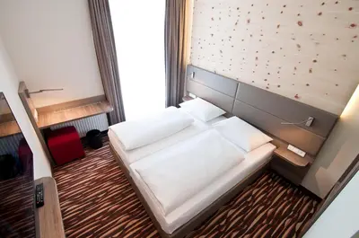 Ein Bett oder Betten in einem Zimmer der Unterkunft Amaro Hotel