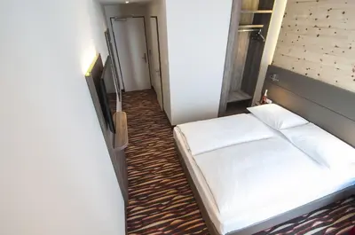 Ein Bett oder Betten in einem Zimmer der Unterkunft Amaro Hotel