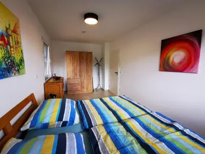 Ein Bett oder Betten in einem Zimmer der Unterkunft Ferienwohnung Kolpingstraße