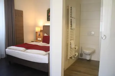 Ein Bett oder Betten in einem Zimmer der Unterkunft Boutique Hotel zur Post