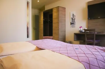 Ein Bett oder Betten in einem Zimmer der Unterkunft Boutique Hotel zur Post