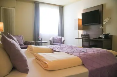 Ein Bett oder Betten in einem Zimmer der Unterkunft Boutique Hotel zur Post