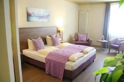 Ein Bett oder Betten in einem Zimmer der Unterkunft Boutique Hotel zur Post
