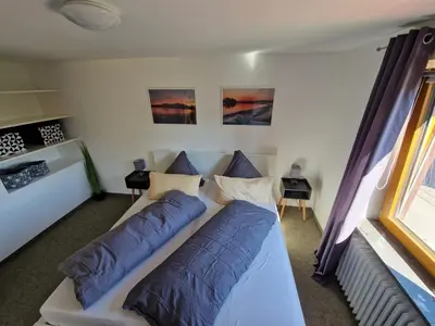 Ein Bett oder Betten in einem Zimmer der Unterkunft FeWo Chiemgau