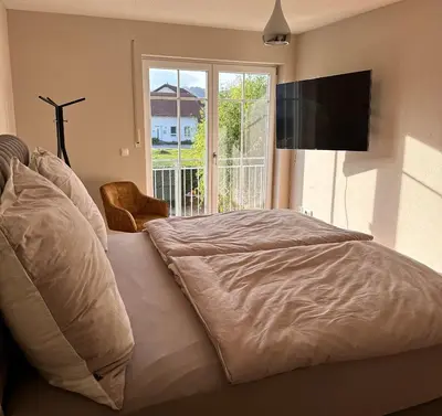 Ein Bett oder Betten in einem Zimmer der Unterkunft Haus am Mühlbach