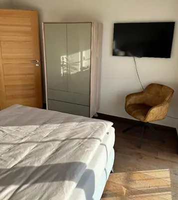 Ein Bett oder Betten in einem Zimmer der Unterkunft Haus am Mühlbach
