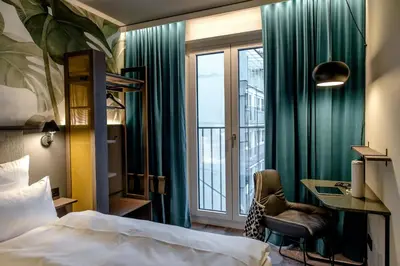 Ein Bett oder Betten in einem Zimmer der Unterkunft Motel One München Hauptbahnhof