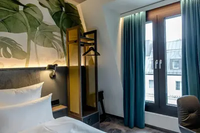 Ein Bett oder Betten in einem Zimmer der Unterkunft Motel One München Hauptbahnhof