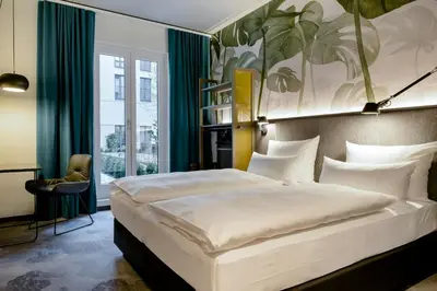 Ein Bett oder Betten in einem Zimmer der Unterkunft Motel One München Hauptbahnhof