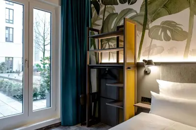 Ein Bett oder Betten in einem Zimmer der Unterkunft Motel One München Hauptbahnhof
