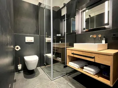Ein Badezimmer in der Unterkunft Mikes Apartments Munich